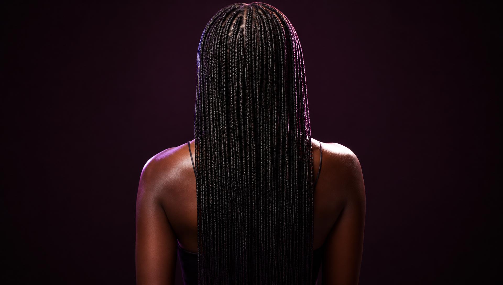 Hair braiding studio client protective style presentation